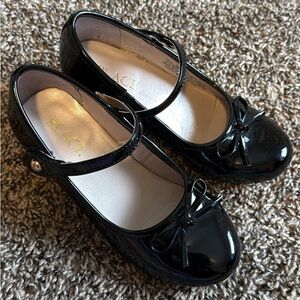 Place Shiny Black Dress Shoes for Kids